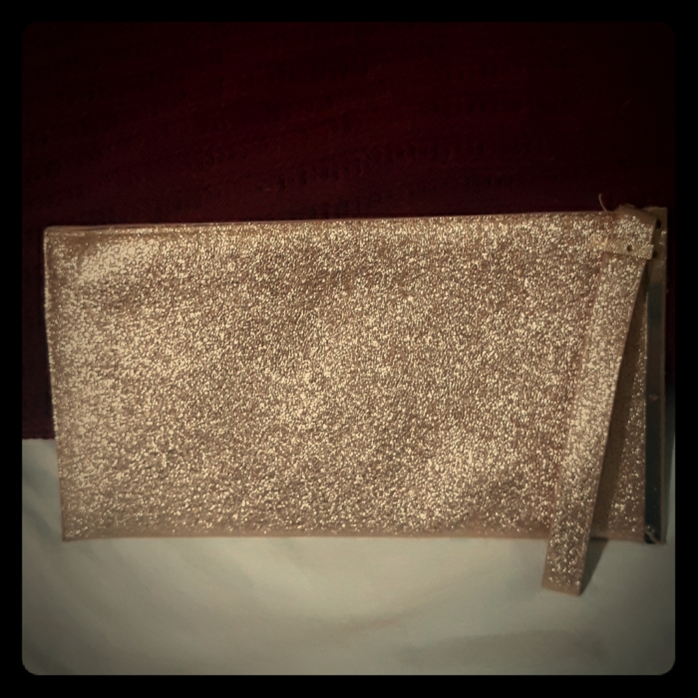 shiny rose gold clutch purse